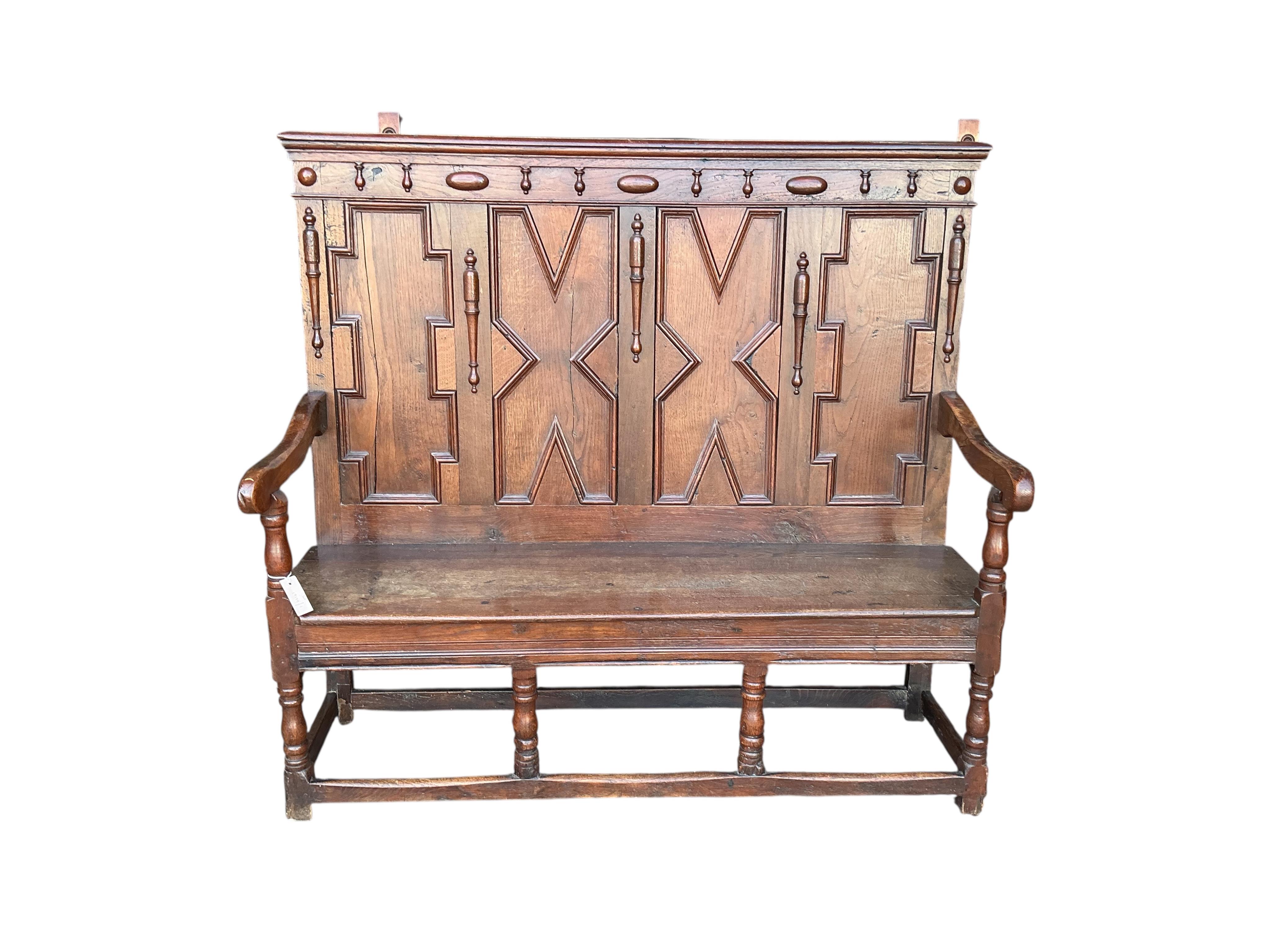 A Victorian panelled oak settle, width 173cm, depth 46cm, height 126cm